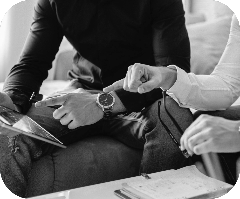 Person wearing a watch while looking at a tablet.